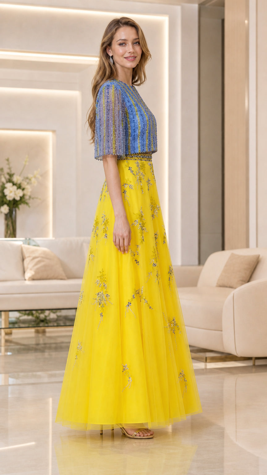 Side-angle view of model in yellow and blue flutter-sleeve embellished maxi dress