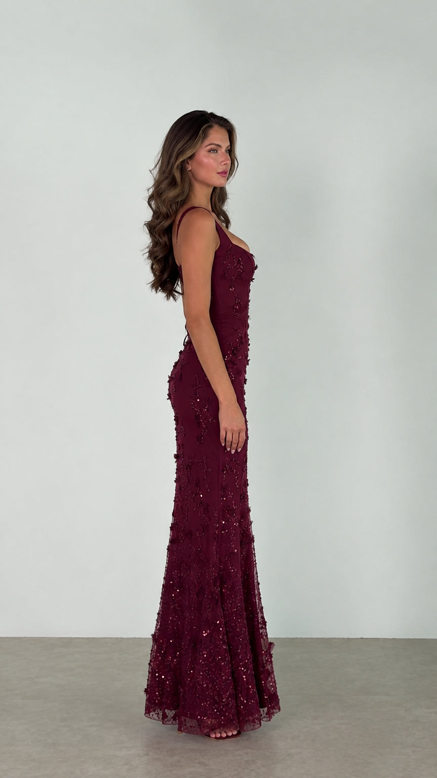 Side profile view of the Burgundy floral embroidered evening dress