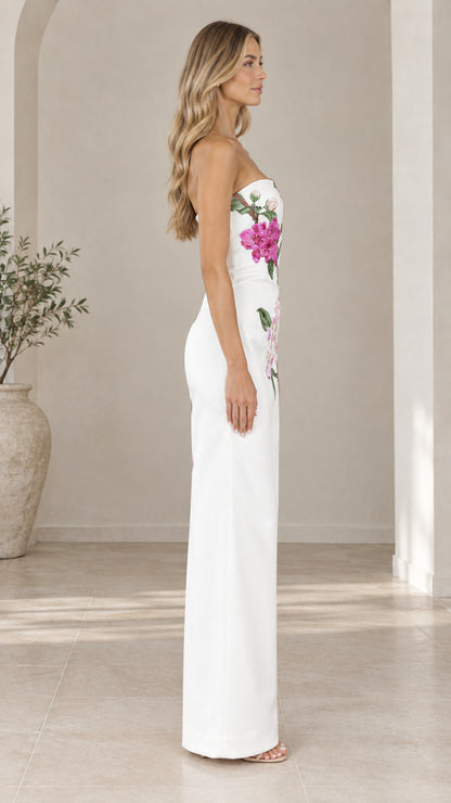 Side profile of white strapless floral embroidered column dress