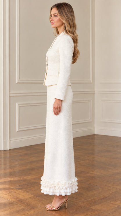 Side profile view of ivory tweed long skirt suit with tailored blazer