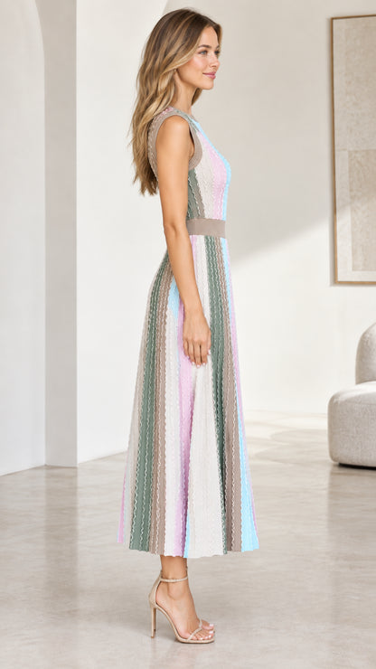 Side view of model in taupe multi colorblock ribbed knit midi dress