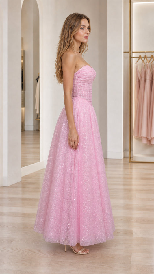 Side profile of pink strapless shimmer tulle maxi dress