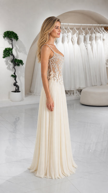 Side profile view of ivory pleated formal maxi dress with embellished top