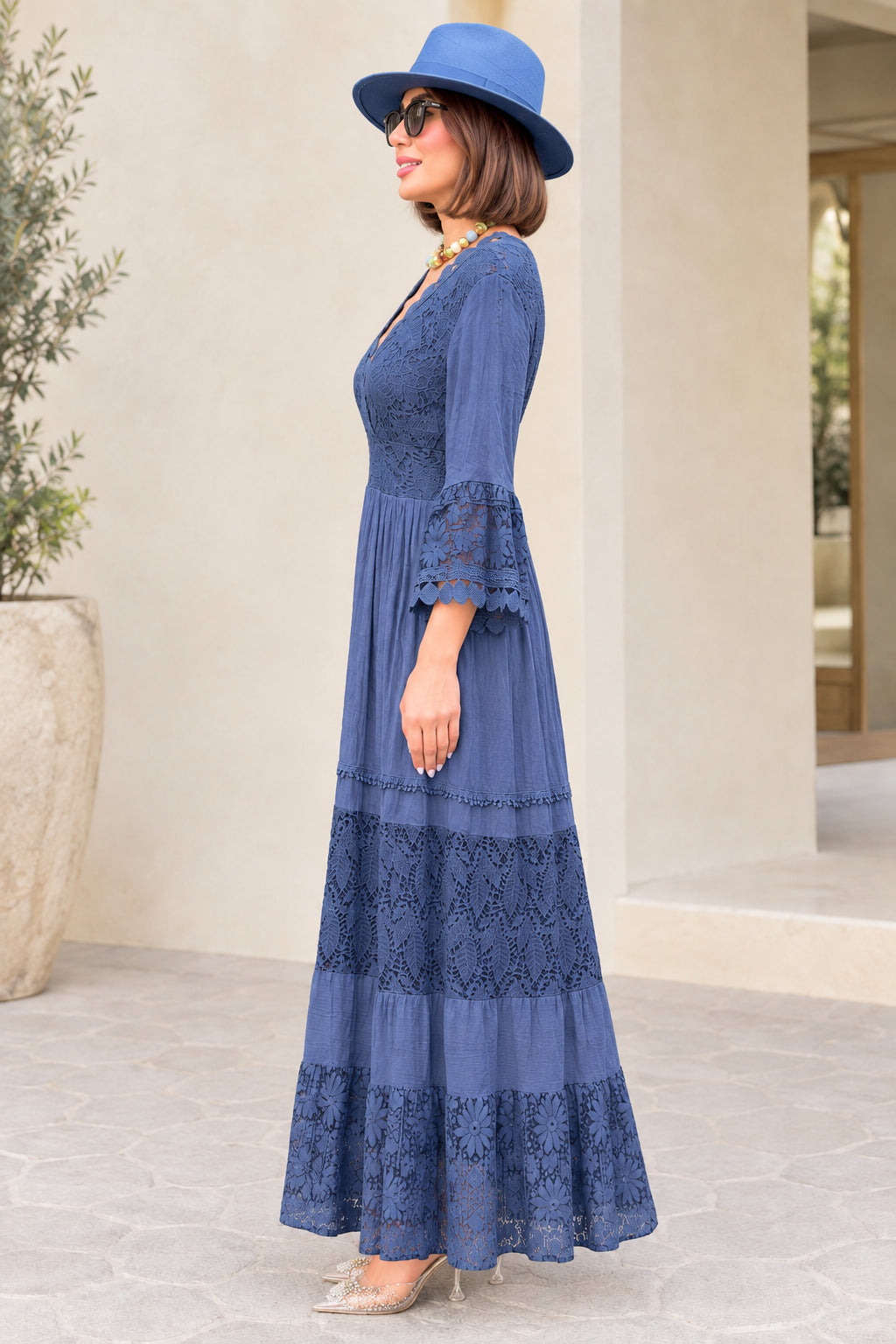 Side profile view of Slate Blue lace tiered maxi dress with bell sleeves