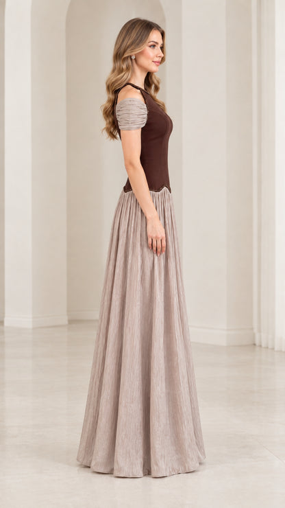 Side profile view of chocolate brown and taupe pleated evening gown