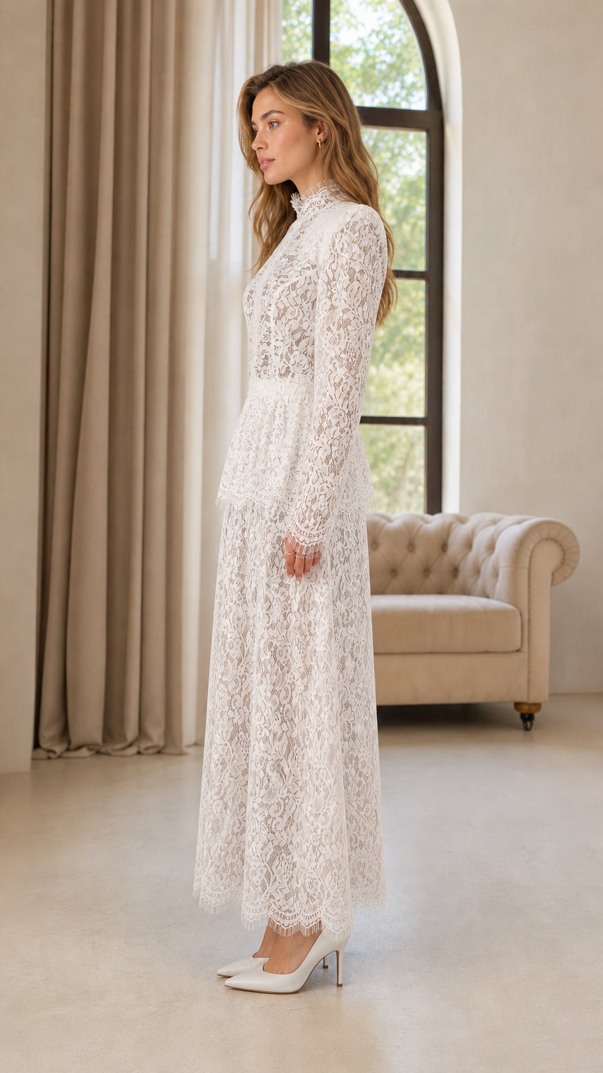 Side profile view of woman modeling white lace long sleeve wide leg jumpsuit