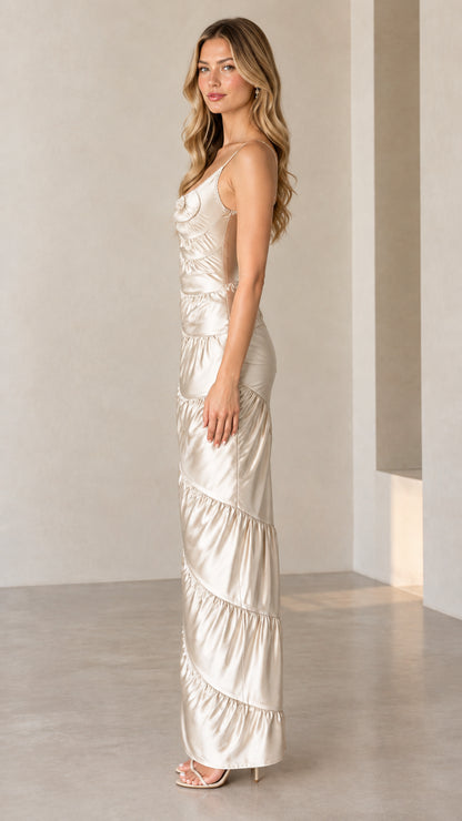 Side profile view of woman wearing Champagne ruched satin maxi dress