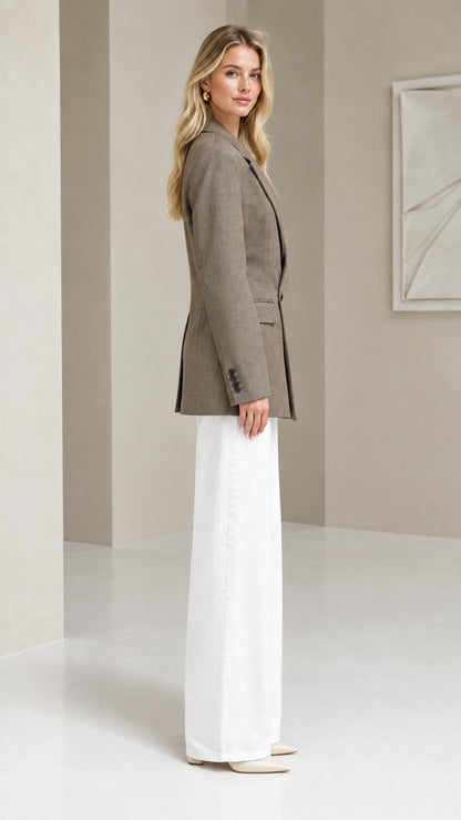 Side profile of taupe tailored blazer showing clean structured silhouette