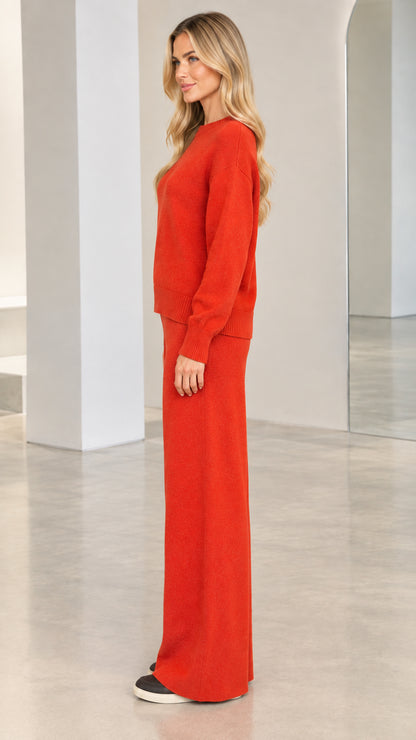 Side profile view of model in rust red two-piece knit lounge set