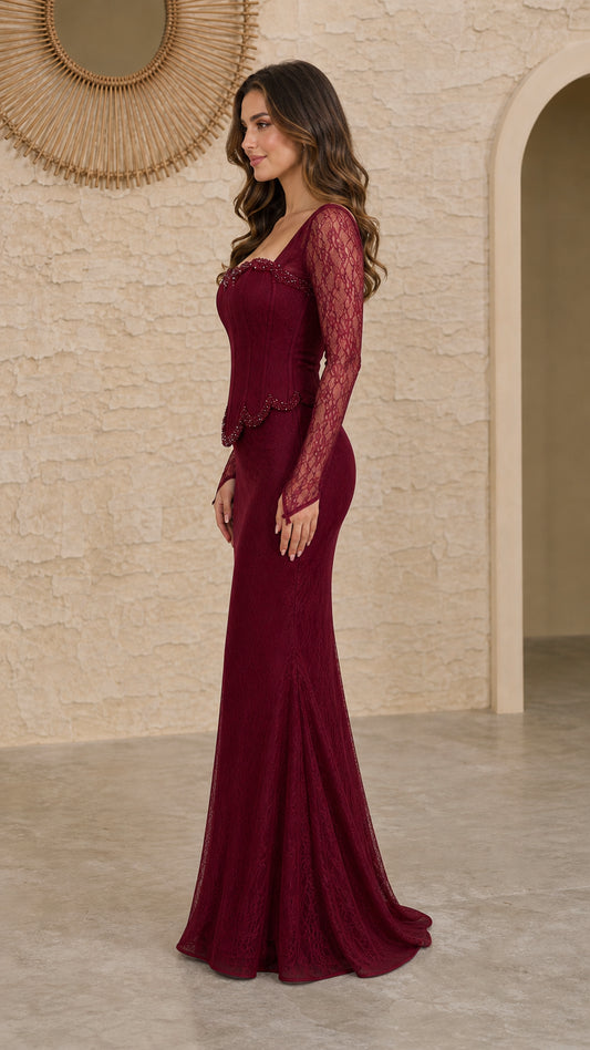 Side profile view of burgundy mermaid lace gown with sheer long sleeves