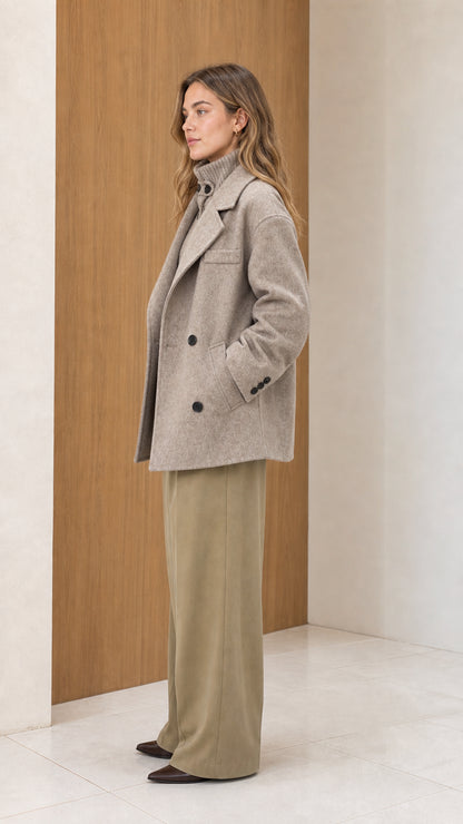 Side profile of women's oatmeal heather wool blend peacoat showing relaxed tailored fit