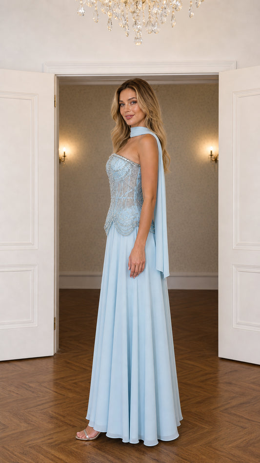 Side profile of sky blue beaded corset formal gown with flowing scarf