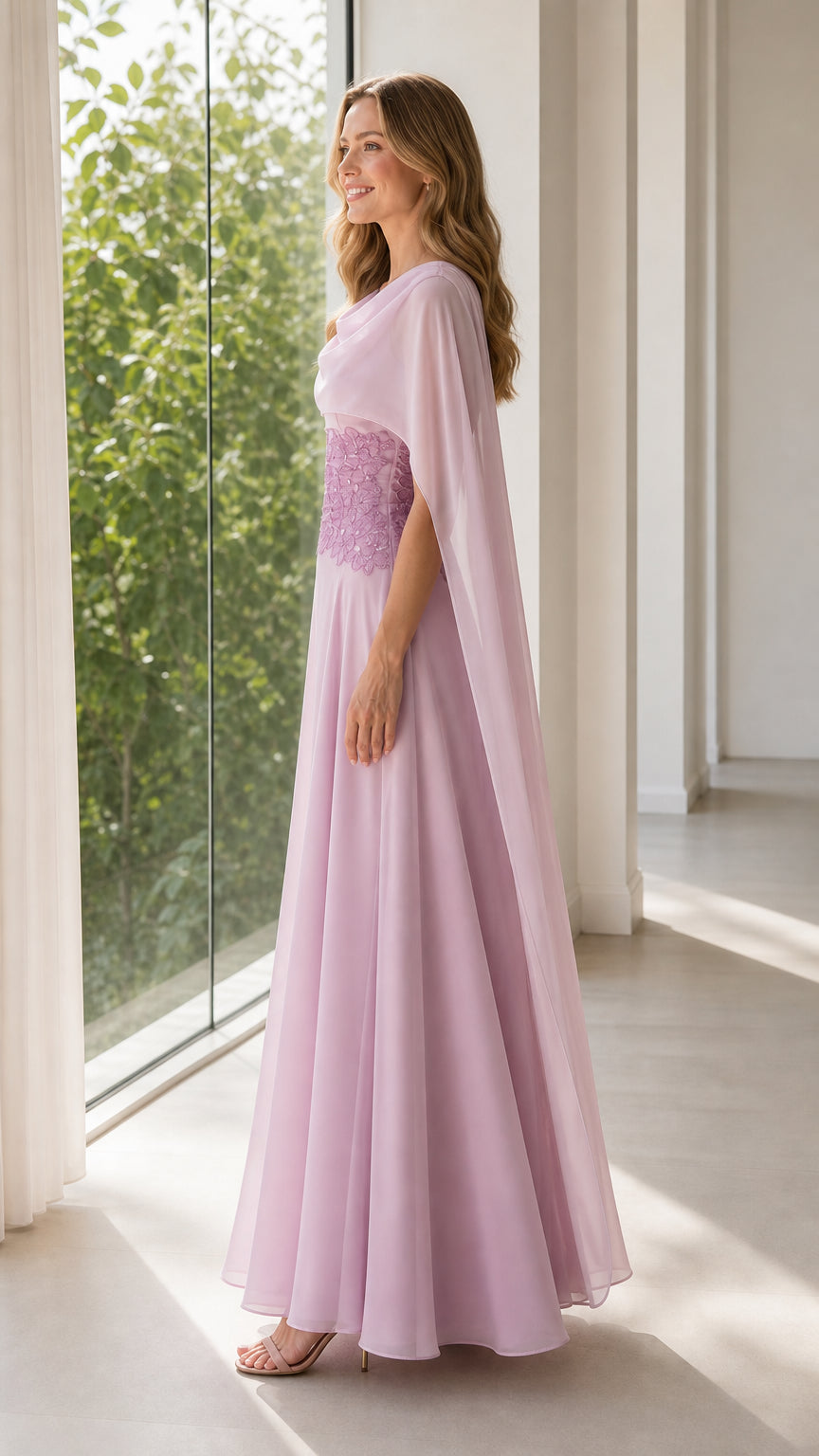 Side profile view of lilac floor length chiffon gown with draped cape overlay
