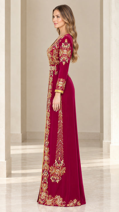Burgundy embroidered velvet maxi gown side view showing detailed sleeve and hem trim