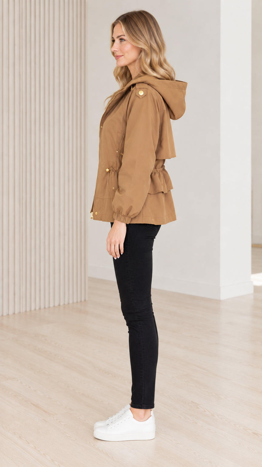 Side profile view of model wearing camel hooded jacket with tiered back detail