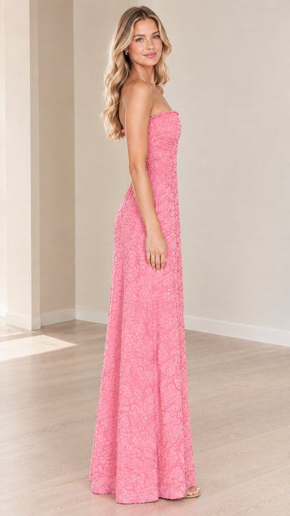 Side view of model wearing pink strapless floral textured maxi dress