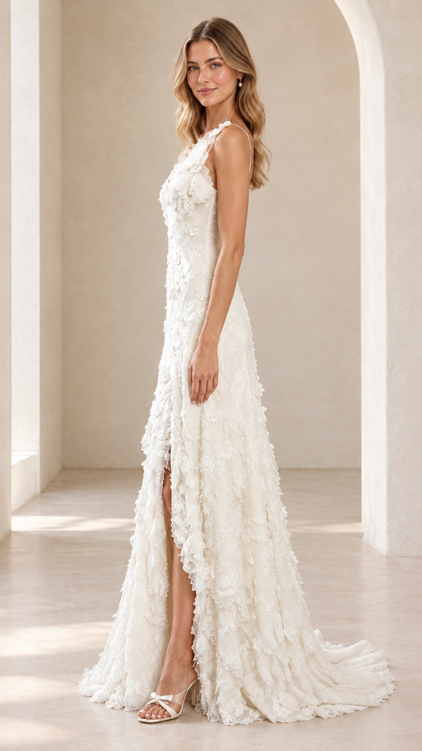 Side angle view showing the high leg slit and sweep train of the ivory lace gown