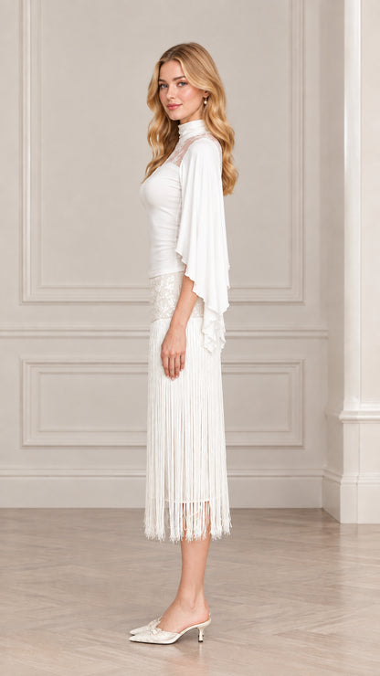 Side view of model in elegant white lace capelet fringe cocktail dress