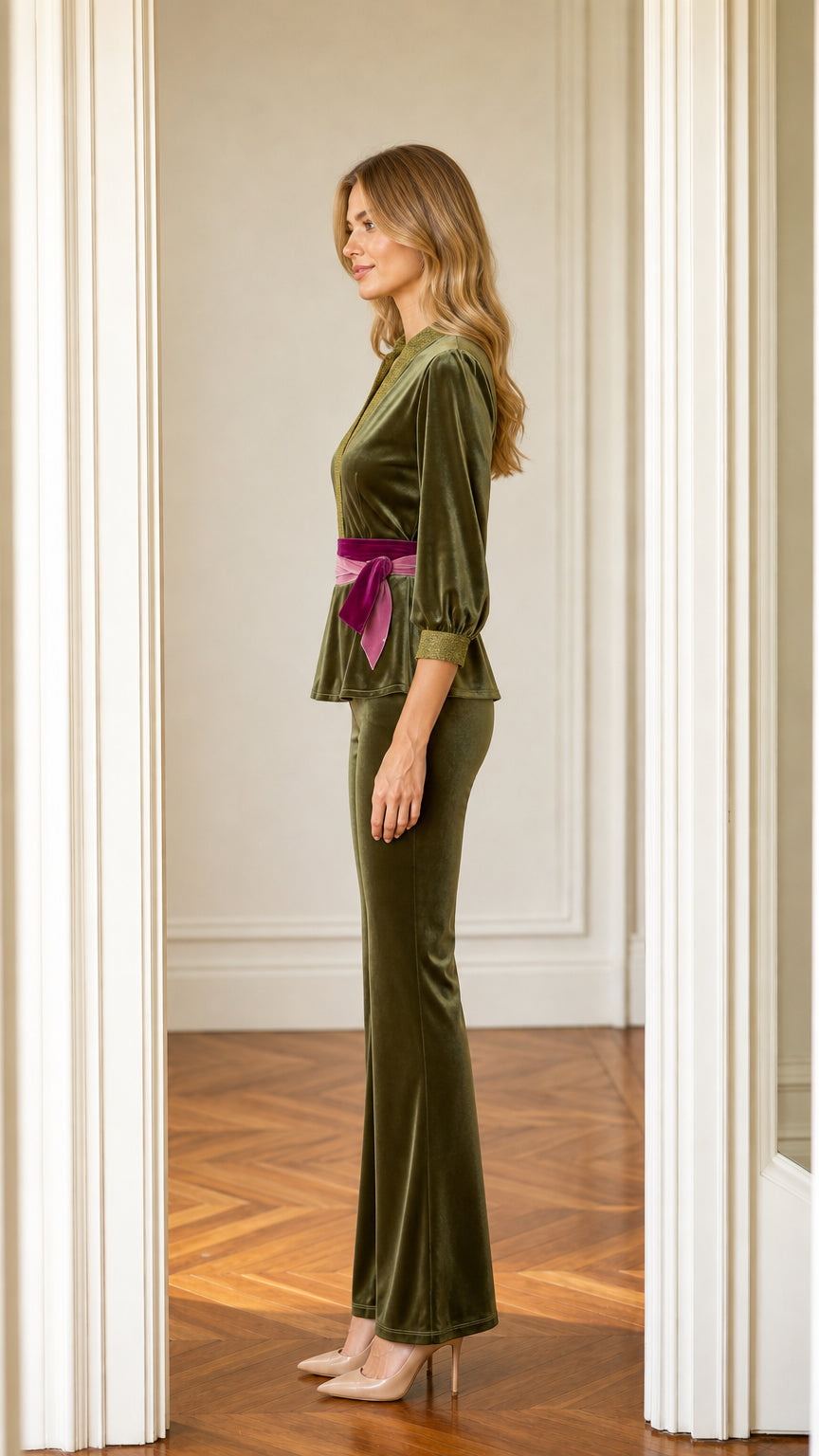 Side profile of model wearing olive green velvet two-piece set