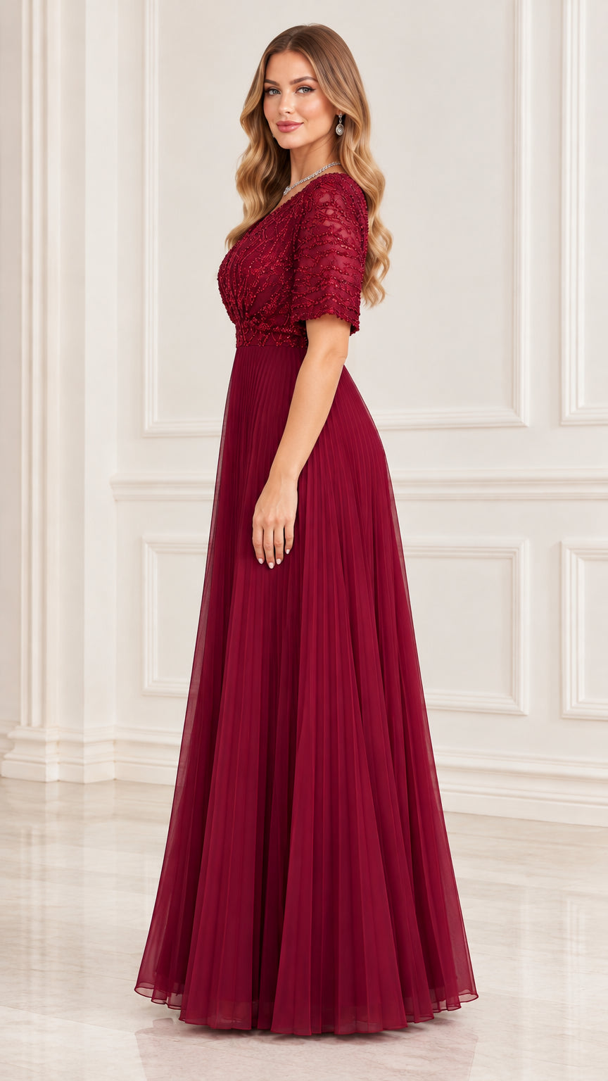 Side profile view of burgundy pleated A-line formal gown with short sleeves