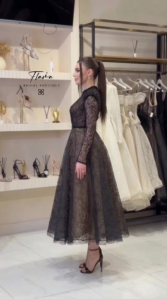 Side profile of black lace A-line evening dress on model