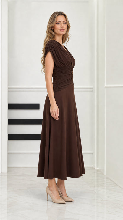 Side profile view of model wearing chocolate brown draped midi dress