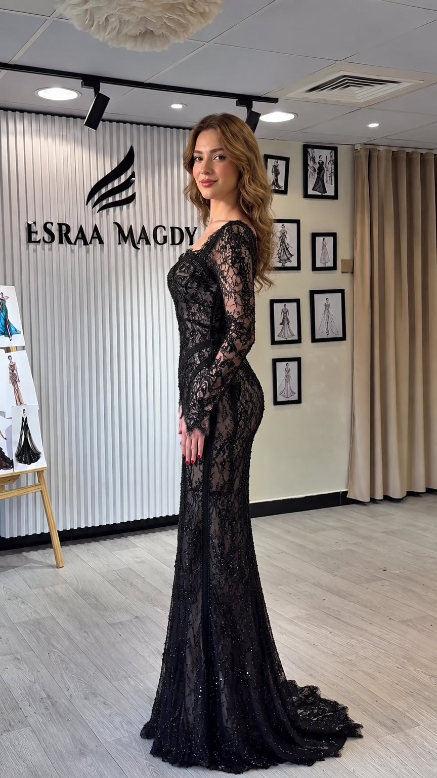 Side profile view of black sequined lace mermaid formal dress