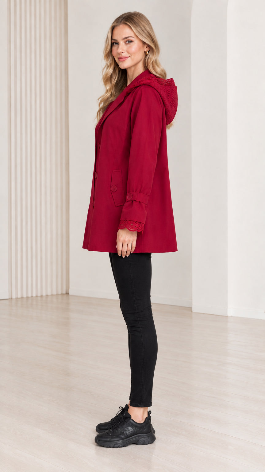 Side view of women's red mid-length hooded jacket
