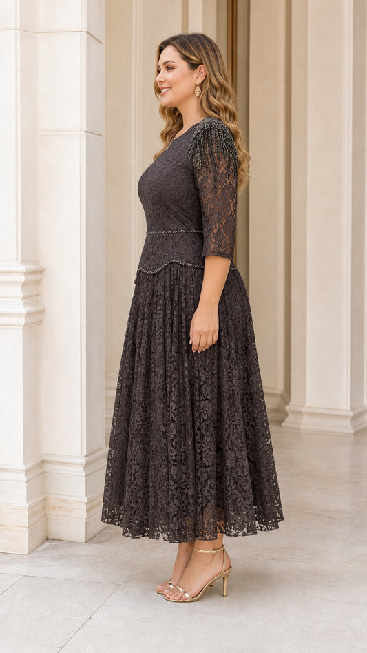 Side profile view of plus size dark charcoal lace dress