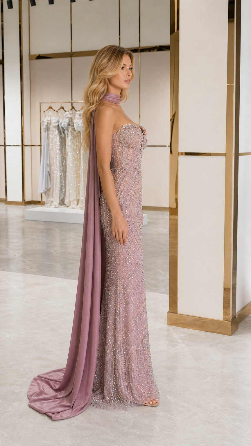 Dusty rose formal sequin evening gown showing side silhouette and flowing cape