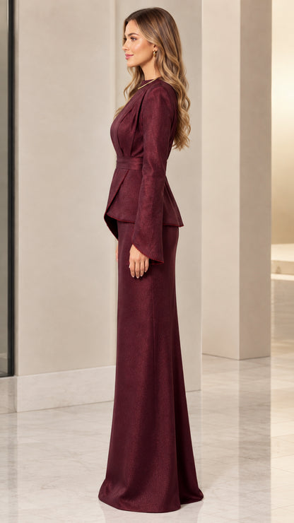 Side view of model wearing burgundy formal peplum maxi dress with slit sleeves