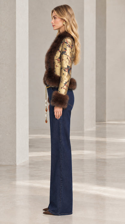 Model wearing gold floral jacquard blazer with brown faux fur trim side view