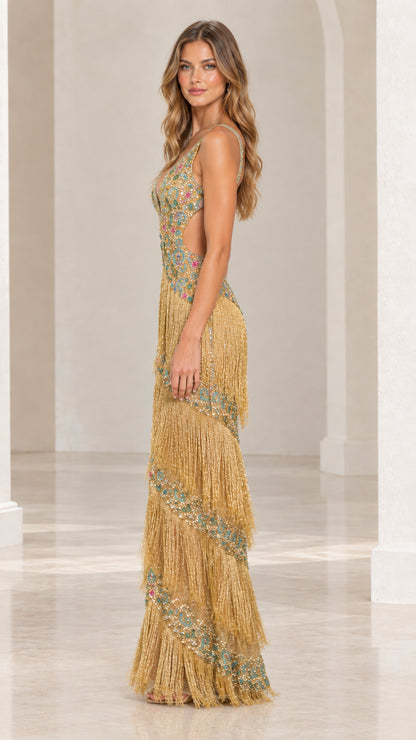 Side profile of gold beaded fringe maxi dress showcasing side cutout detail