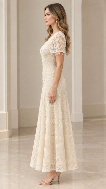 Side profile of woman in champagne lace evening maxi dress