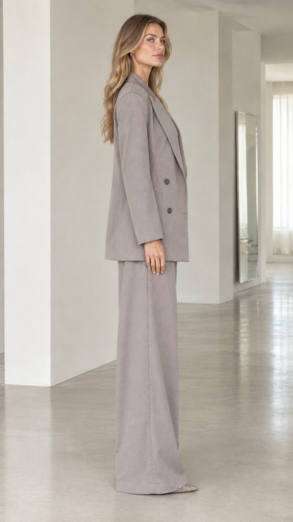 Side profile view of taupe grey 3-piece suit set showing relaxed tailored drape