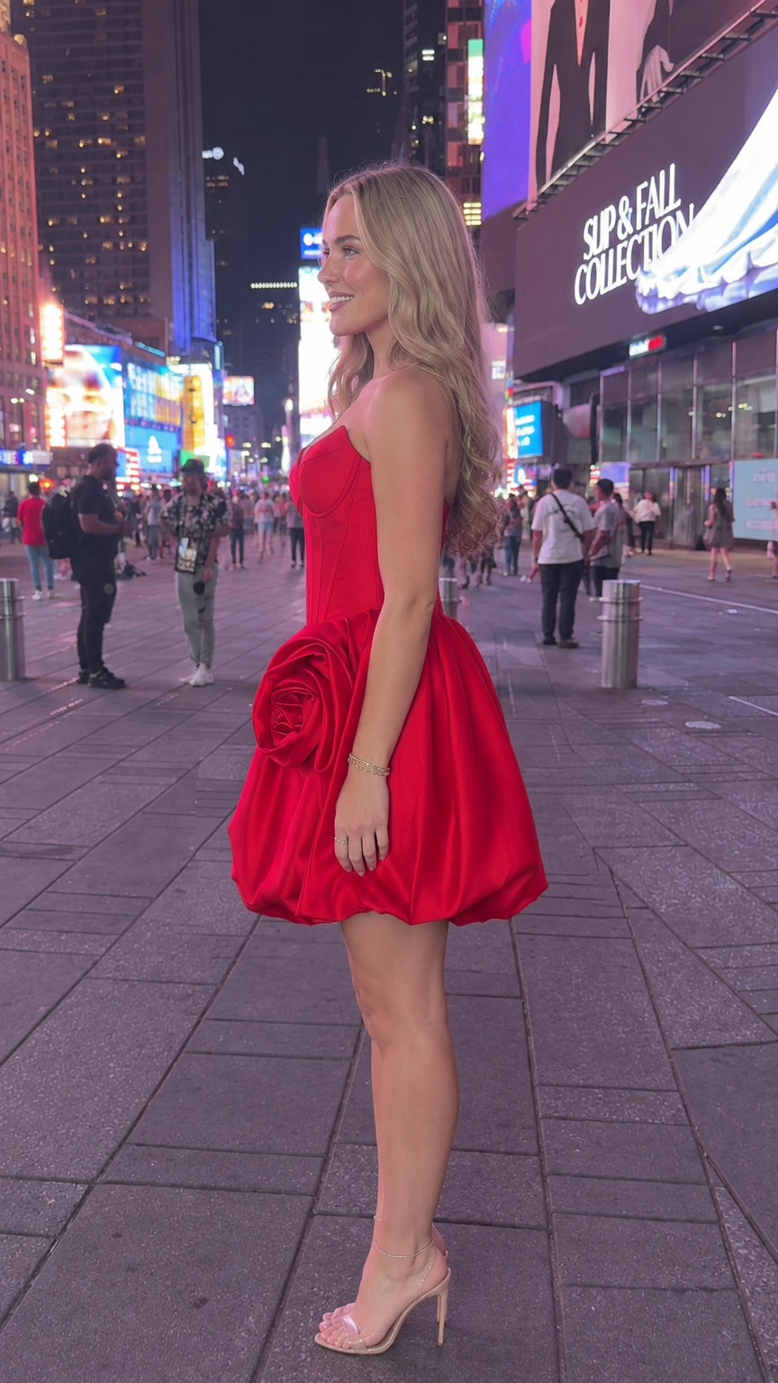 Side profile of red strapless rosette bubble mini dress