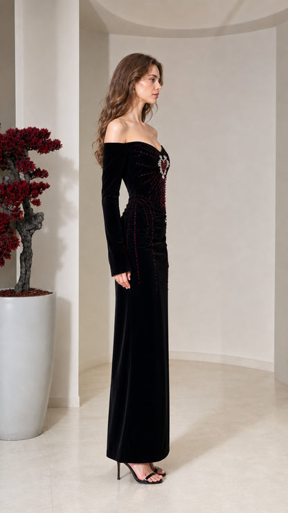 Side profile of black off-the-shoulder velvet evening gown