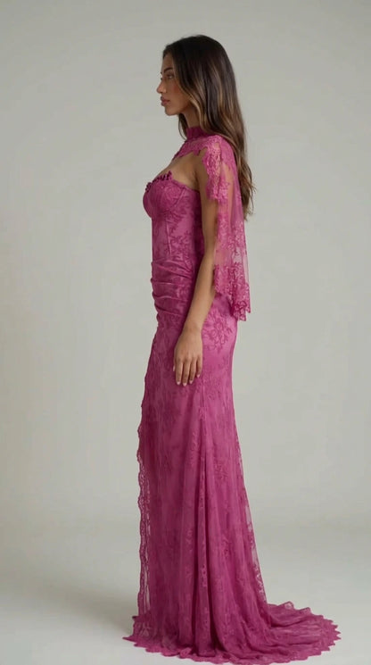 Side profile view of magenta lace maxi gown showing ruched hip detail and sweep train