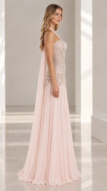 Side profile view of blush pink formal dress showcasing fit and drape