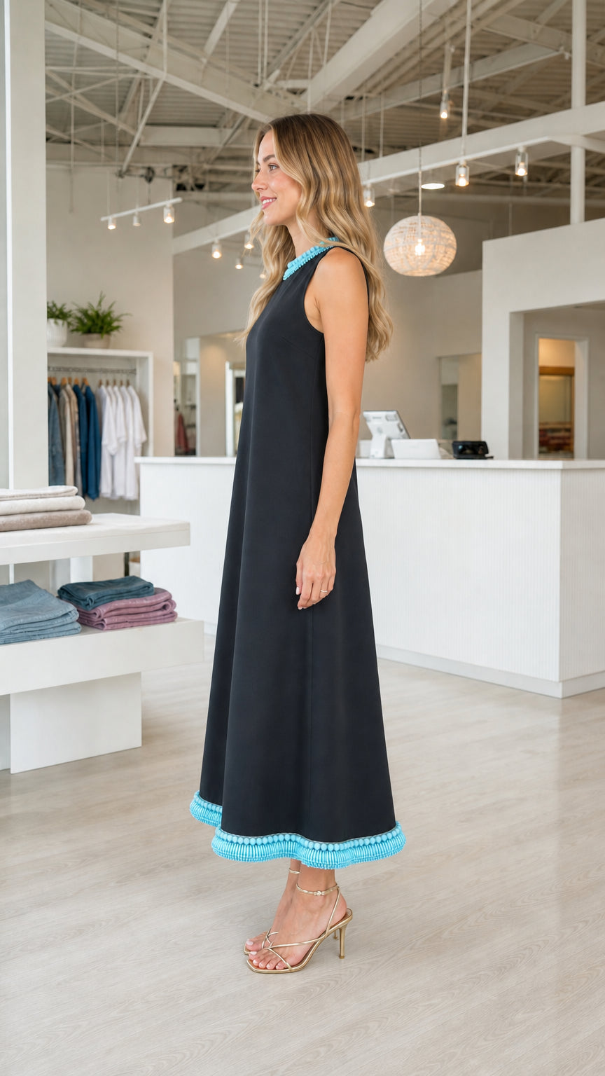 Side view of model wearing black sleeveless A-line midi dress
