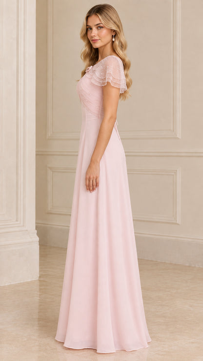 Side profile view of blush pink formal capelet maxi dress