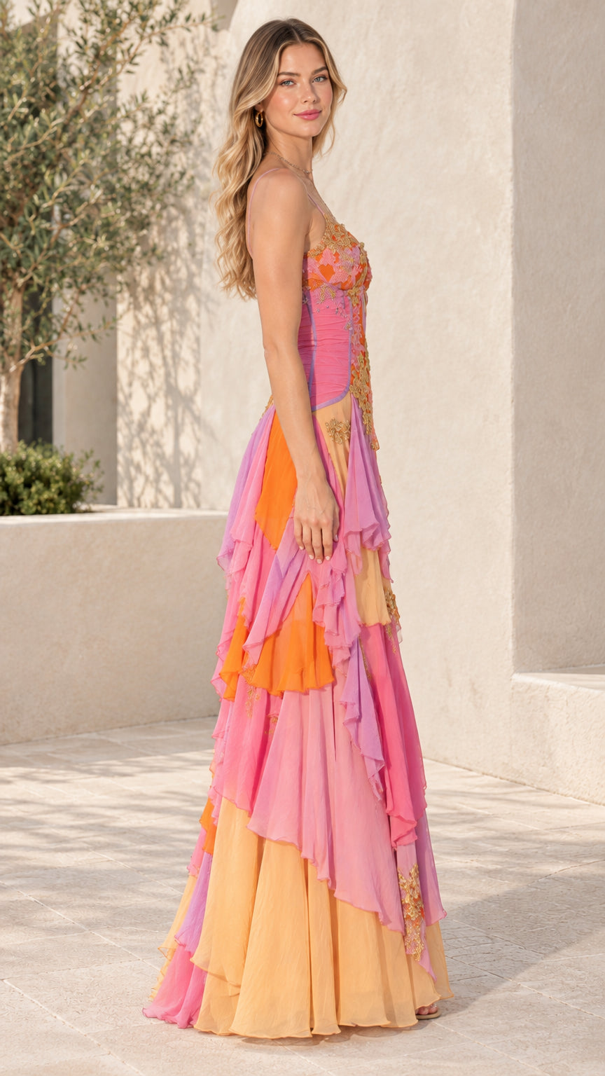 Side profile of model in Sunset Multi spaghetti strap tiered ruffle maxi gown
