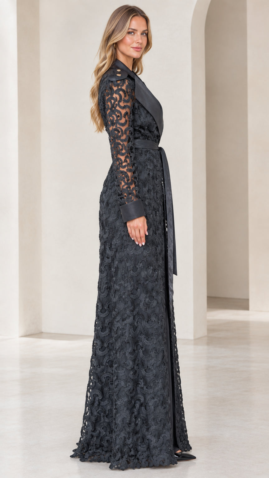Side profile view of model wearing black floor-length lace evening duster