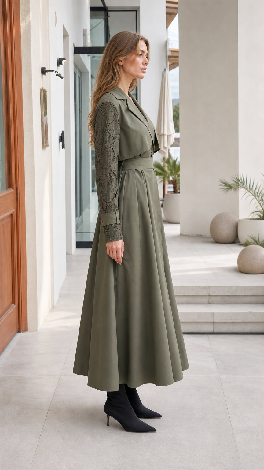 Side profile of woman in Olive Green lace-sleeve maxi trench coat dress