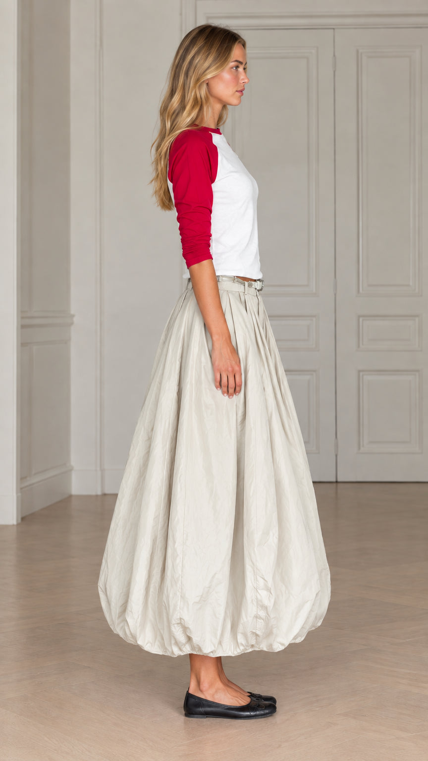 Side profile view of women's balloon maxi skirt and raglan sleeve top in red and cream