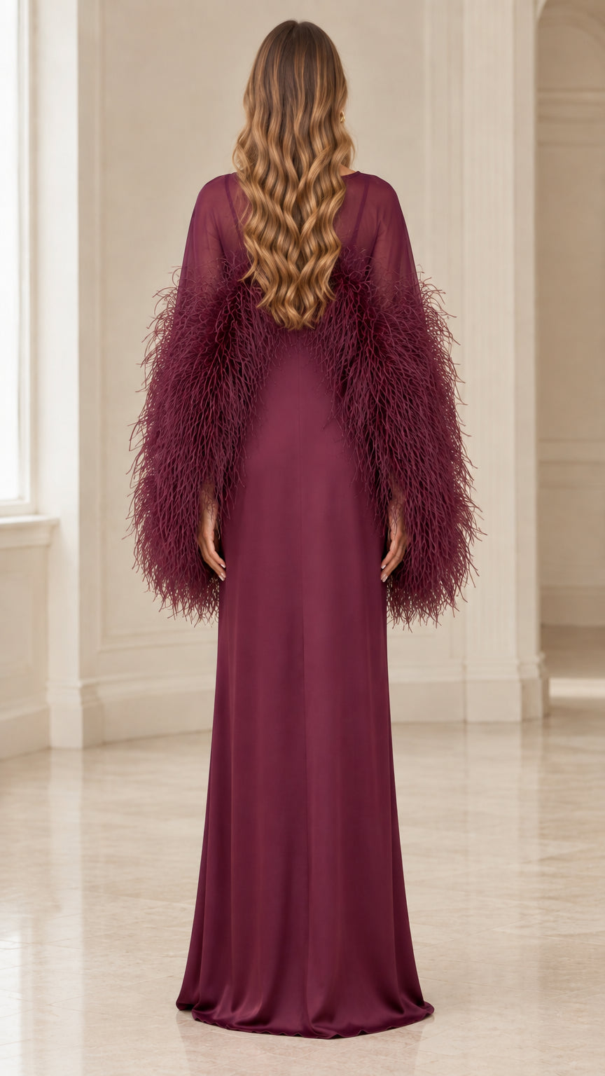 Back view of floor length burgundy evening gown with feather details
