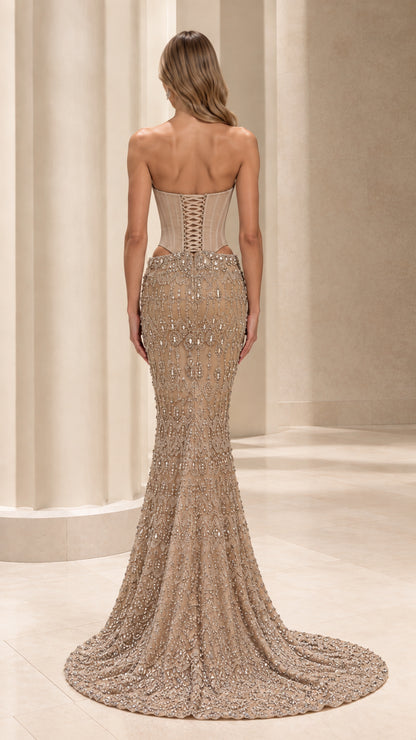 Back view of champagne formal mermaid gown showing lace-up corset closure and sweeping train