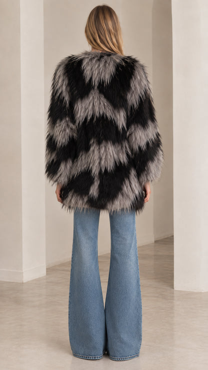 Back view of black and grey zig-zag pattern faux fur winter coat