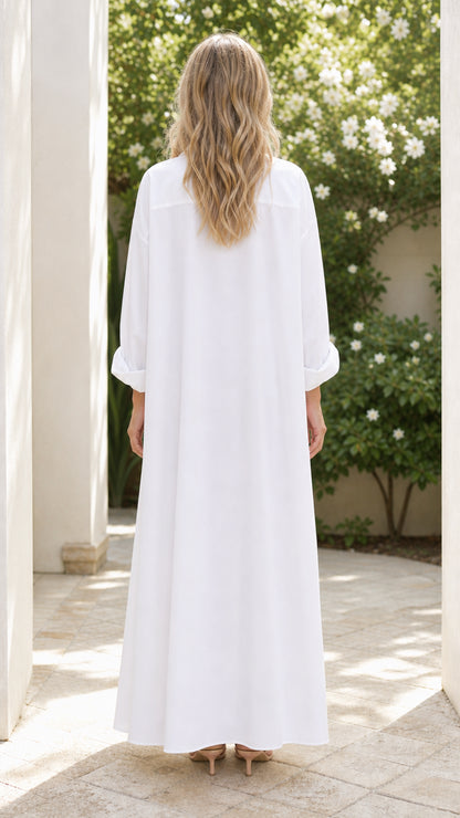 Back view of woman wearing white button down maxi shirt dress