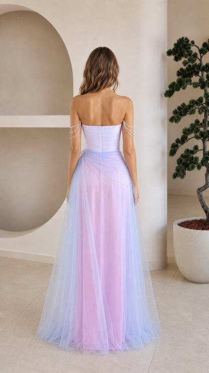 Back view of model in pastel ombre strapless tulle evening gown